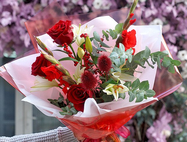 Bouquet of red roses, gladioli, and white lilies photo