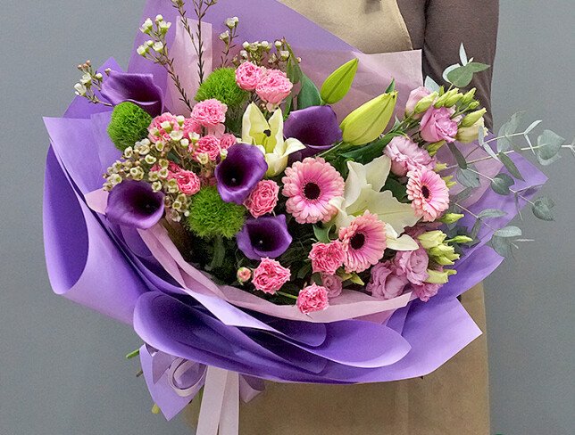 Bouquet of white lilies, purple callas, pink gerberas and eustomas photo
