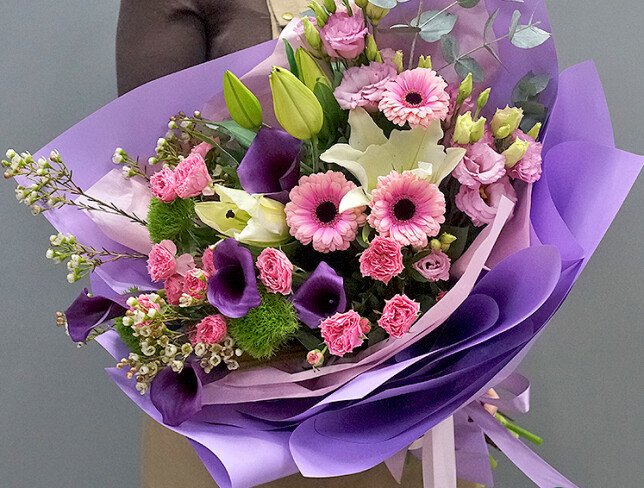Bouquet of white lilies, purple callas, pink gerberas and eustomas photo