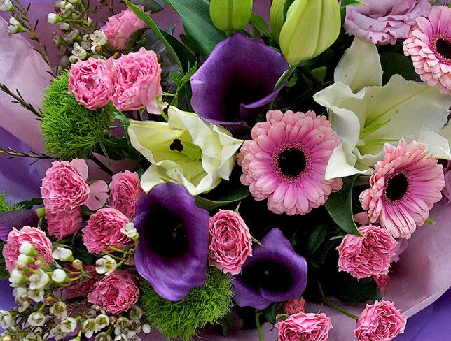 Bouquet of white lilies, purple callas, pink gerberas and eustomas photo