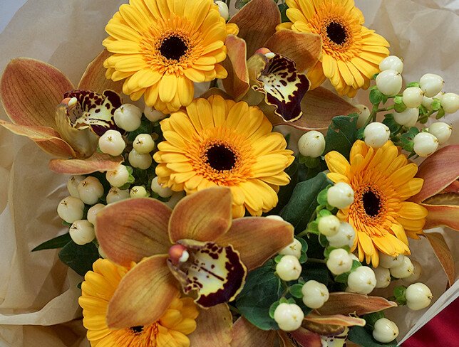 Bouquet of gerberas, orchids and hypericum photo