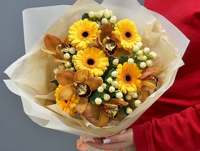 Bouquet of gerberas, orchids and hypericum photo