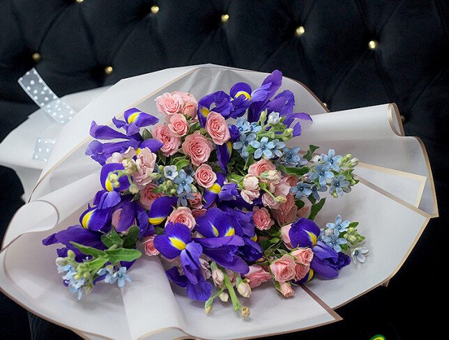 Bouquet of pink spray roses, irises and oxypetalum photo