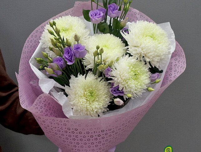 Bouquet of white pompon chrysanthemums and purple lisianthus photo