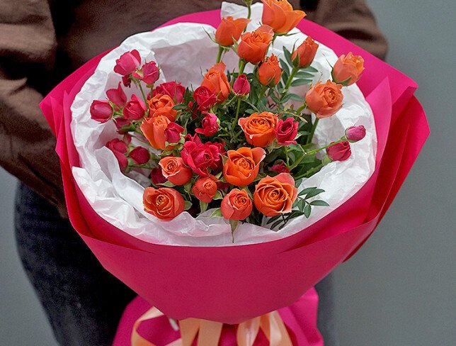 Bouquet with fuchsia and orange bush roses photo
