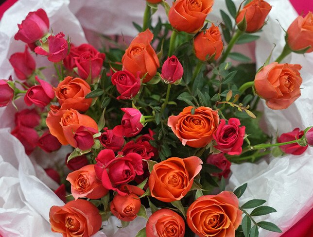 Bouquet with fuchsia and orange bush roses photo
