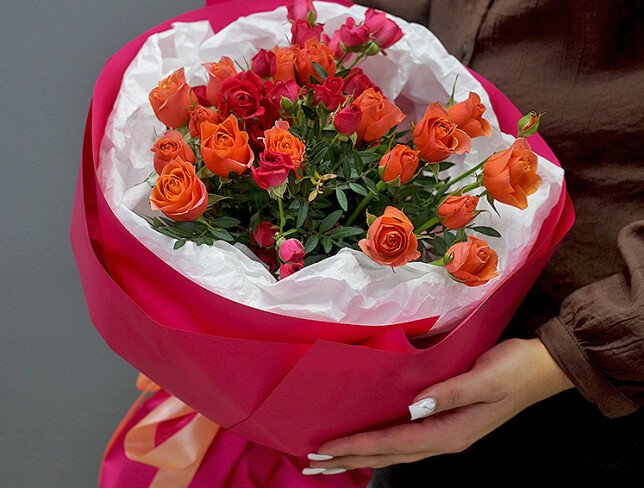 Bouquet with fuchsia and orange bush roses photo