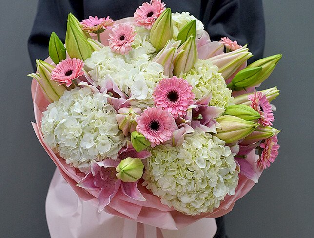 Bouquet of white hydrangeas, pink lilies and gerberas photo