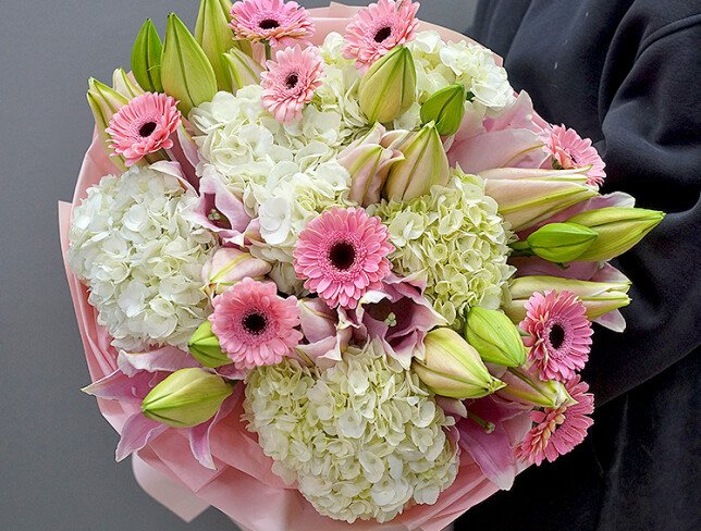 Bouquet of white hydrangeas, pink lilies and gerberas photo