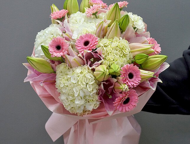 Bouquet of white hydrangeas, pink lilies and gerberas photo