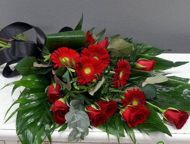 Funeral bouquet with red roses and gerberas photo