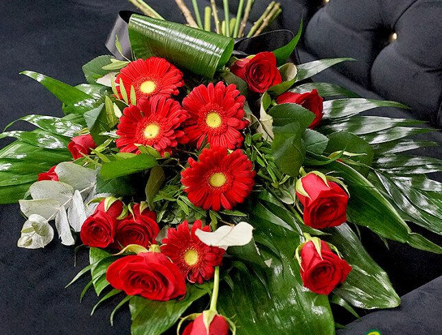 Funeral bouquet with red roses and gerberas photo