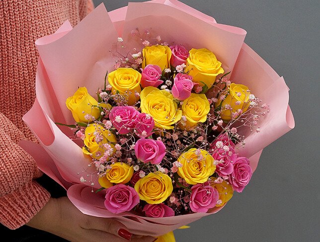 Bouquet of yellow and pink spray roses and gypsophila photo