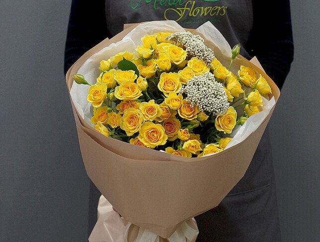 Bouquet with yellow spray roses and ozothamnus photo