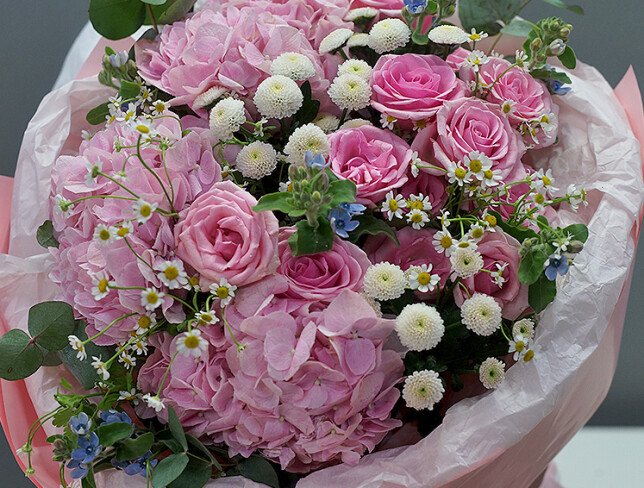 Bouquet of pink hydrangeas, roses, white chrysanthemums and daisies photo