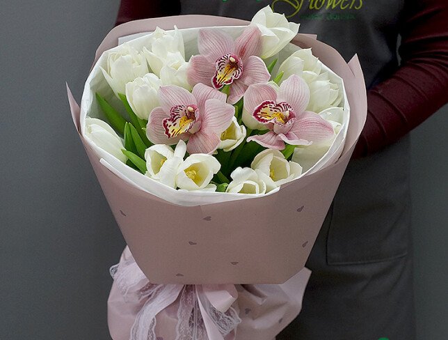 Bouquet of white tulips and pink orchids photo