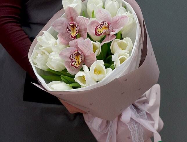 Bouquet of white tulips and pink orchids photo