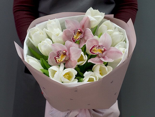 Bouquet of white tulips and pink orchids photo