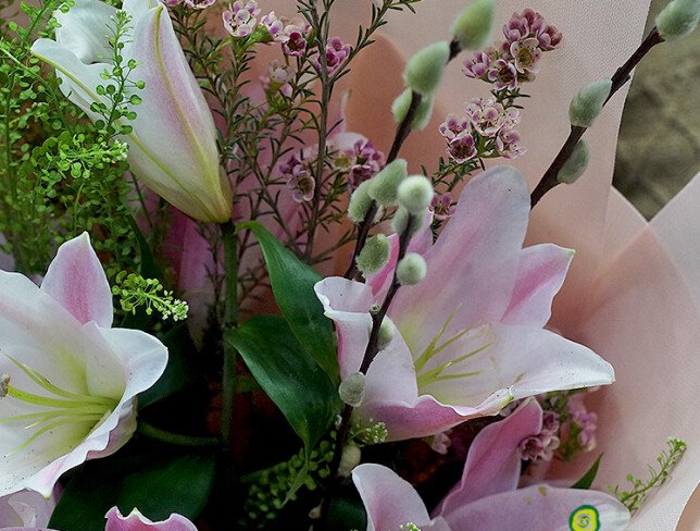 Bouquet with pink lilies, waxflower, and willow photo