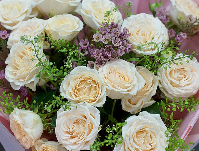 Bouquet of cream spray roses and waxflower photo