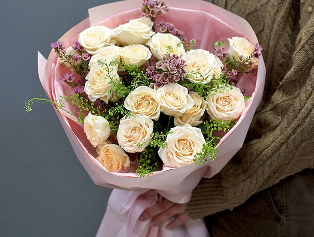 Bouquet of cream spray roses and waxflower photo