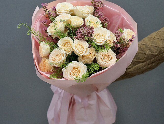 Bouquet of cream spray roses and waxflower photo