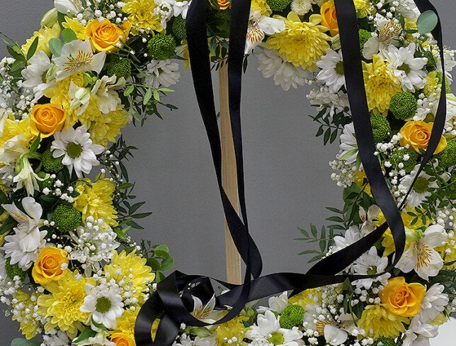 Funeral wreath of yellow roses, chrysanthemums, and alstroemeria (d=55) photo