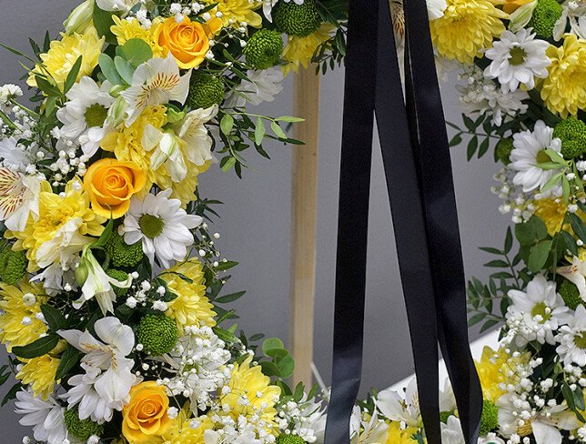 Funeral wreath of yellow roses, chrysanthemums, and alstroemeria (d=55) photo
