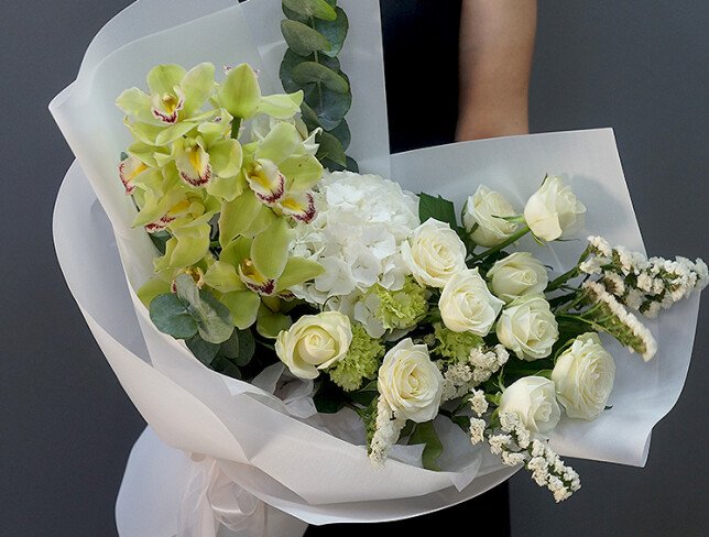 Bouquet with white hydrangea, roses, and green Cymbidium orchids photo