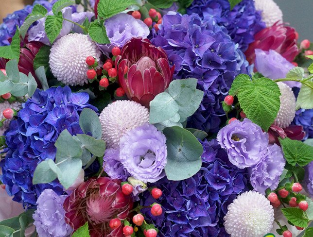 Bouquet with purple hydrangeas, lisianthus and protea photo