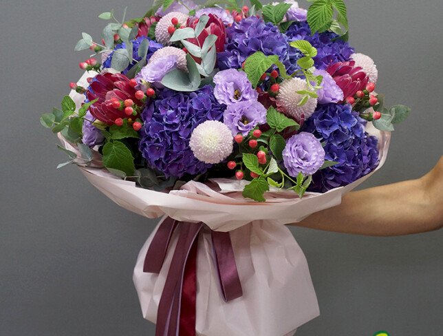 Bouquet with purple hydrangeas, lisianthus and protea photo