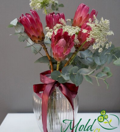 Vase Arrangement with 5 Proteas, Eucalyptus, and Decorative Flowers photo 394x433