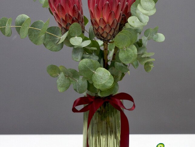 Vase with 3 Proteas and Eucalyptus photo
